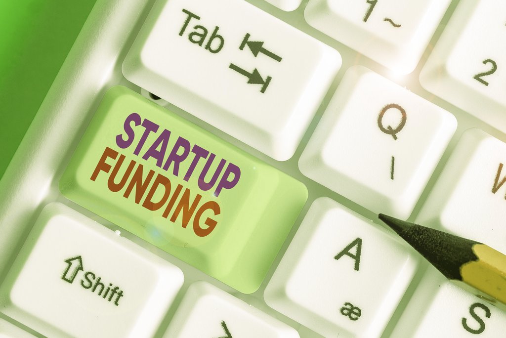 Word writing text startup funding. business concept for financial investment in the development of a new company.